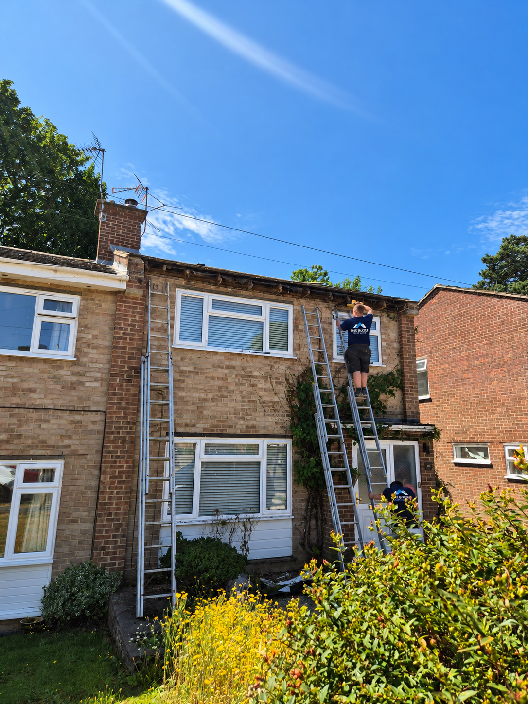Sunny Roof Repair with Branded Workers